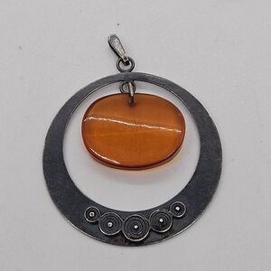 dark silver tone circle pendant with orange bead Soviet Union